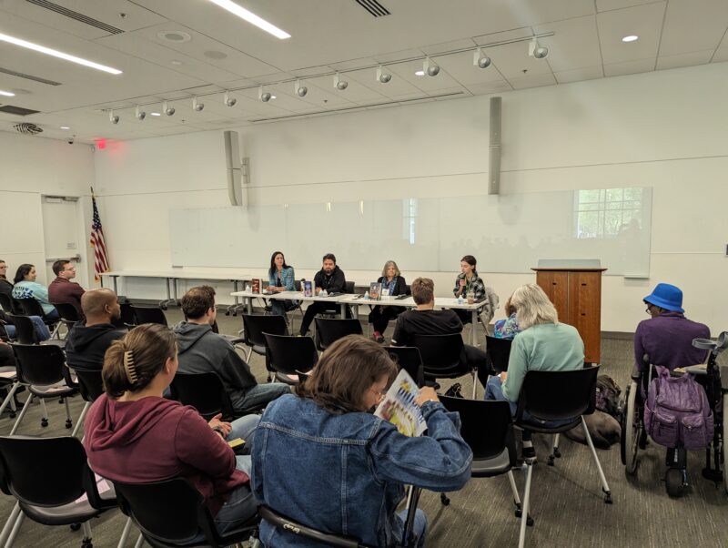 Photo take of Writing for Young Adult Readers panel discussion. The featured speakers are (left to right) Mindy McGinnis, David Arnold and Cinda Williams Chima with a moderator. 